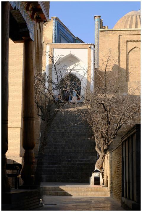 A scenic view of a historic staircase leading up t