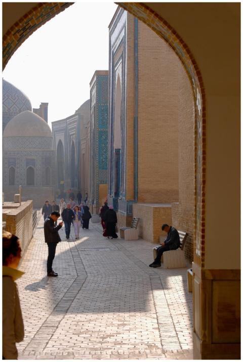 People exploring the historic architecture of Sama