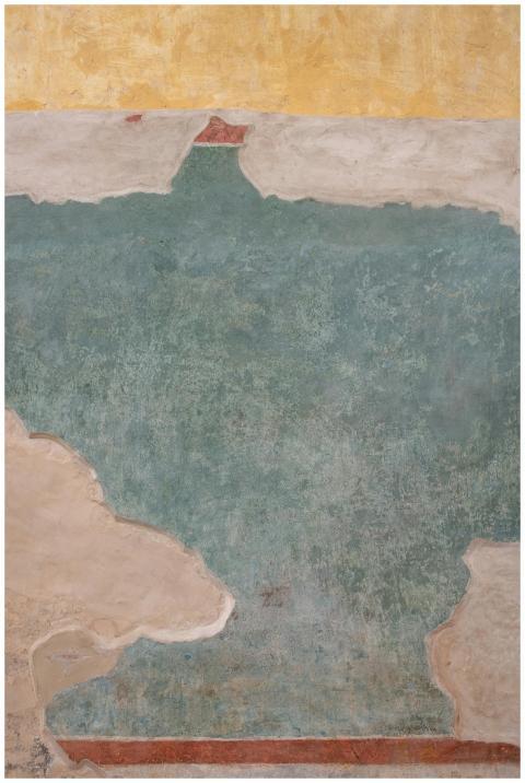 A colorful abstract fresco wall with a textured ar