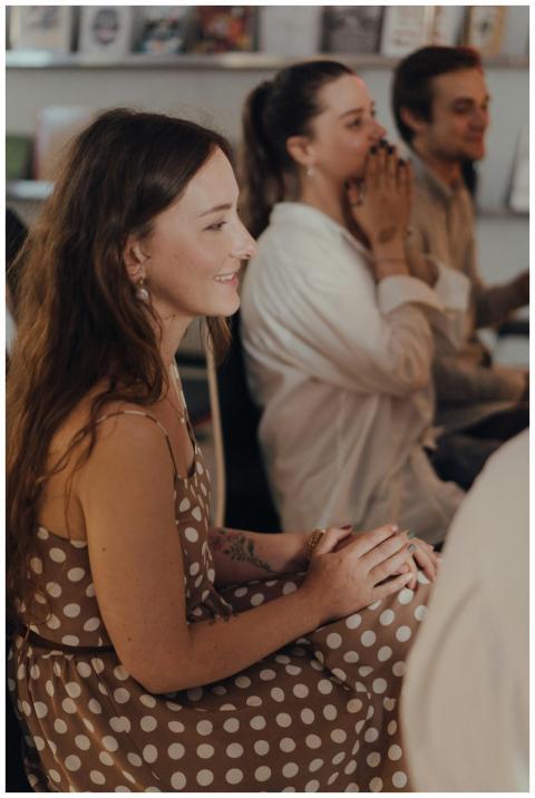 Attendees enjoying a creative discussion indoors w