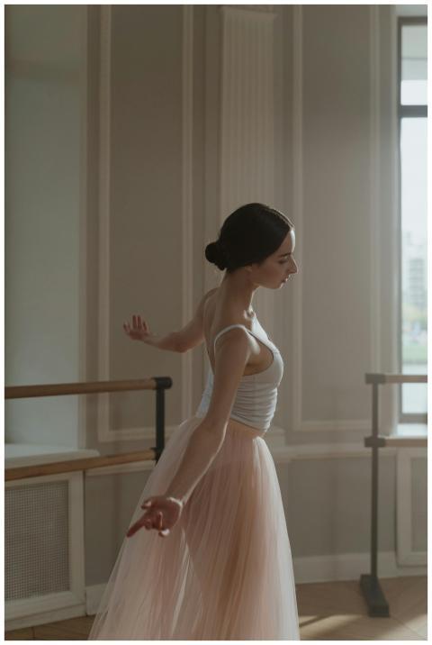Ballet dancer in soft light, exuding grace in a ba
