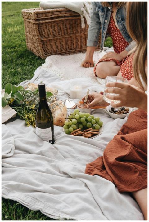 Enjoy a serene outdoor picnic complete with wine,