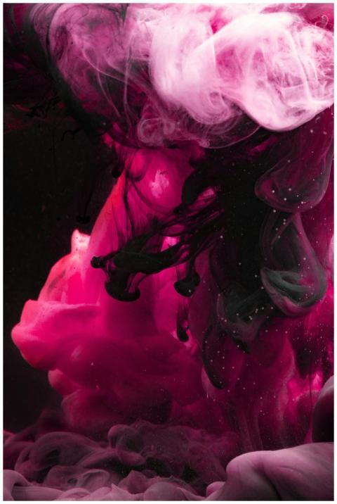 Colorful ink swirling in water creating an abstrac