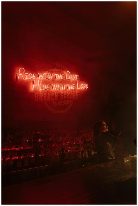 Moody bar scene with neon lights and a philosophic