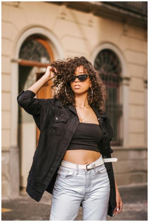 Stylish black woman wearing sunglasses and casual