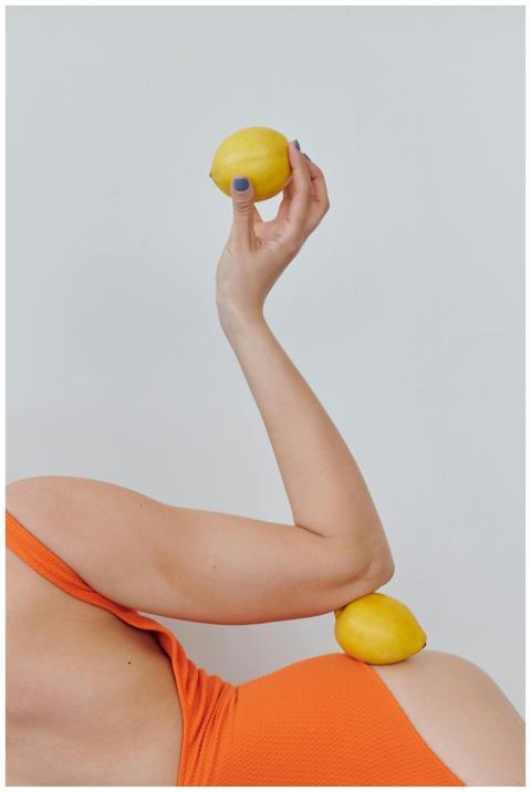 Creative photo of a woman in an orange swimsuit ho