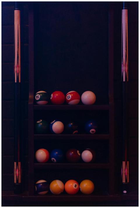 A close-up view of a rack of billiard balls alongs