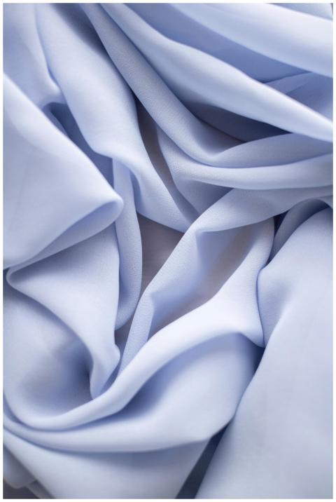 Abstract background representing crumpled light bl