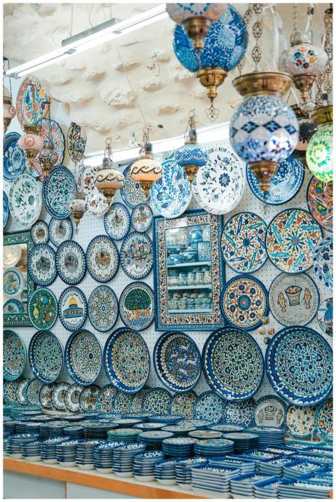 Beautiful ceramic plates and lamps on display at a