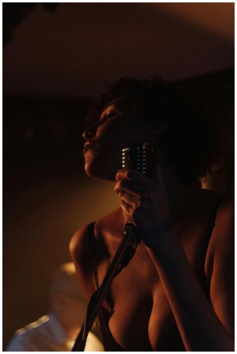 Jazz singer passionately performing with vintage m