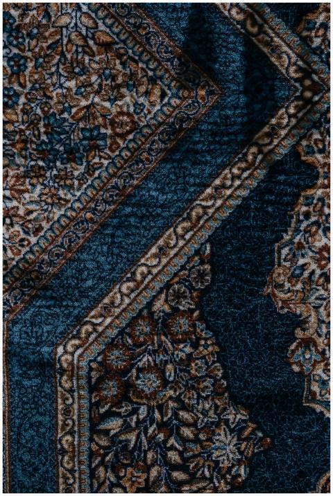 Close-up of a detailed vintage floral carpet desig