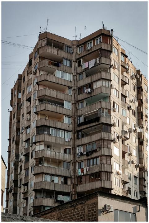 A tall residential building showcasing Soviet-era