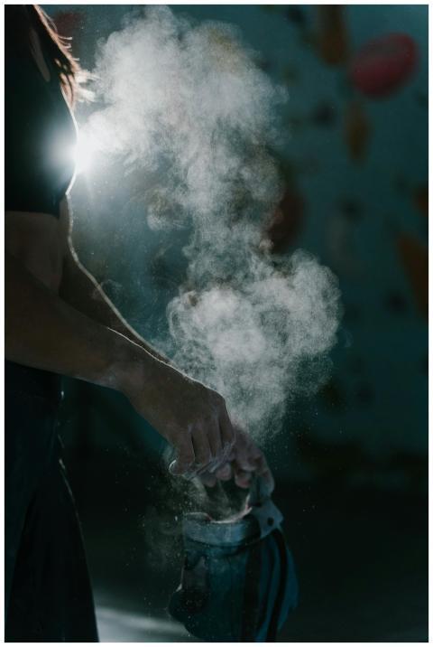 Close-up of hands dusted with climbing chalk, crea