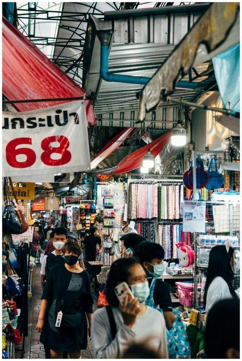 Vibrant scene of people shopping at a bustling Ban