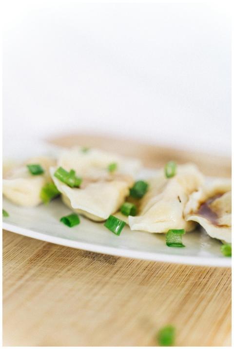 A close-up view of tasty Chinese dumplings garnish