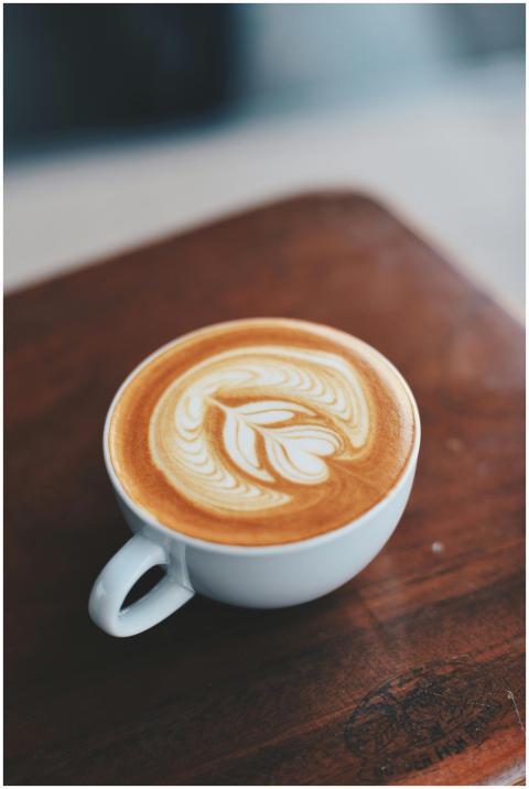 A beautifully crafted latte with intricate latte a