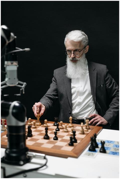 A senior scientist engages in a chess game with a