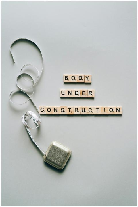 Inspiring fitness concept with 'Body Under Constru