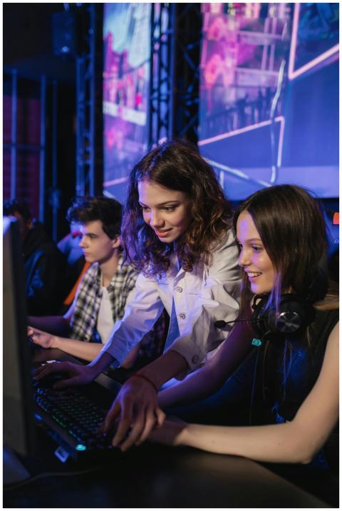 Two enthusiastic young women enjoying a gaming ses