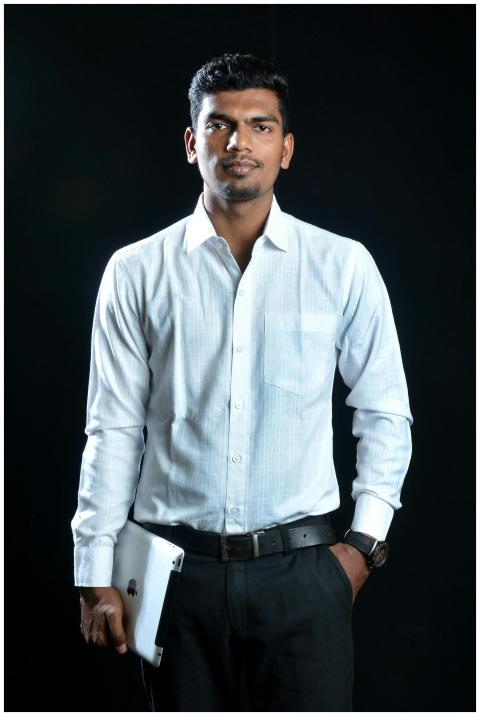 Confident businessman in formal attire holding a t