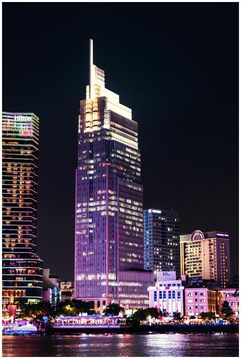 Illuminated skyscrapers in Hồ Chí Minh City reflec