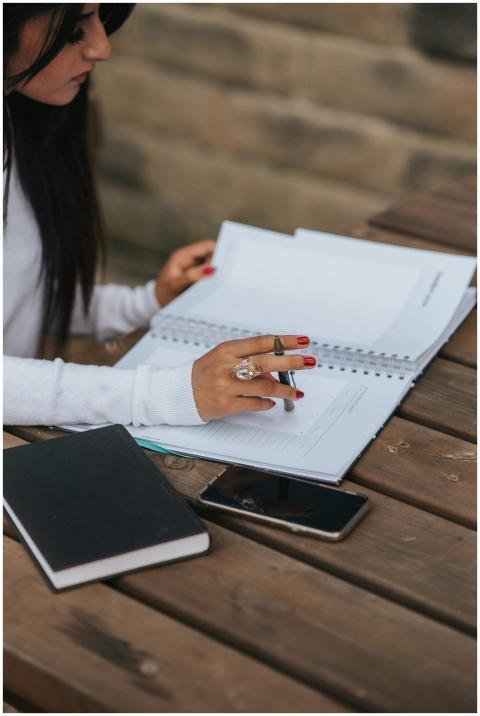 From above of crop thoughtful ethnic female employ