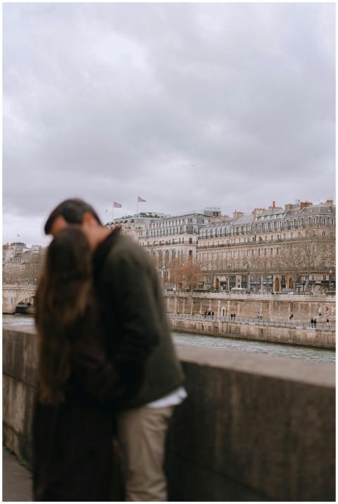 A couple shares a tender moment along the Seine Ri