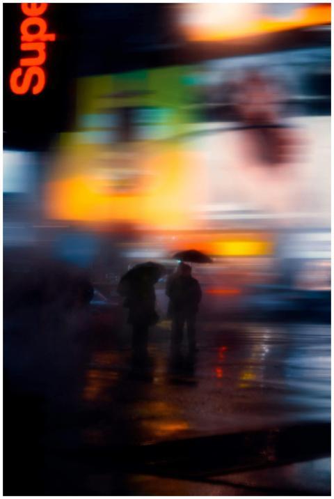 Blurred colorful city street scene at night with u