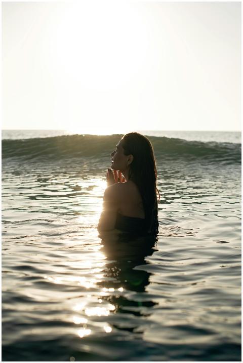 Side view of tranquil young female tourist with lo