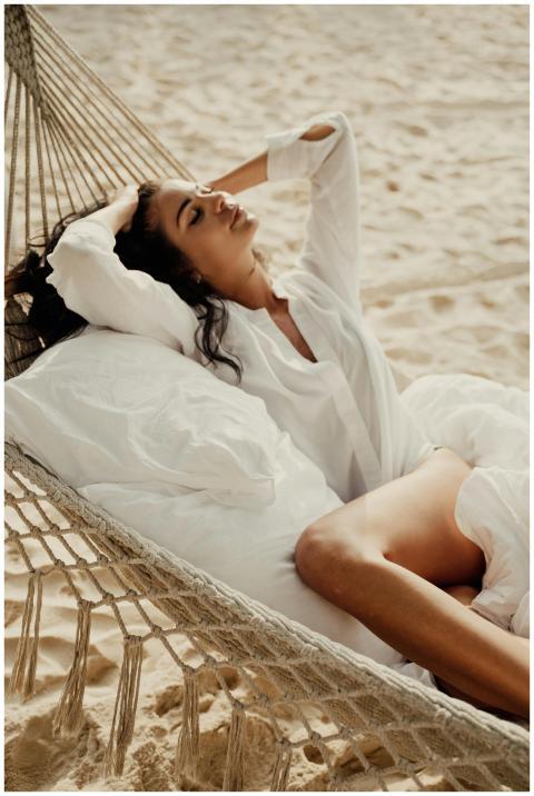 Woman in white enjoying a peaceful moment on a ham