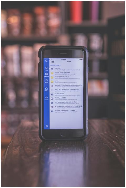 A smartphone with a messaging app screen, placed o