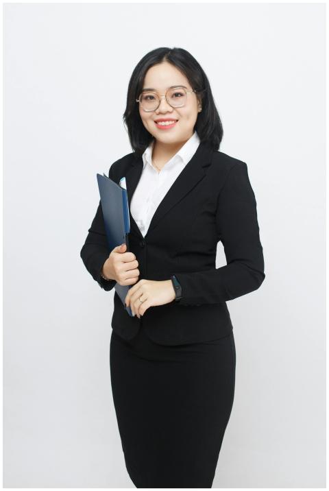 Confident businesswoman smiling in a studio settin
