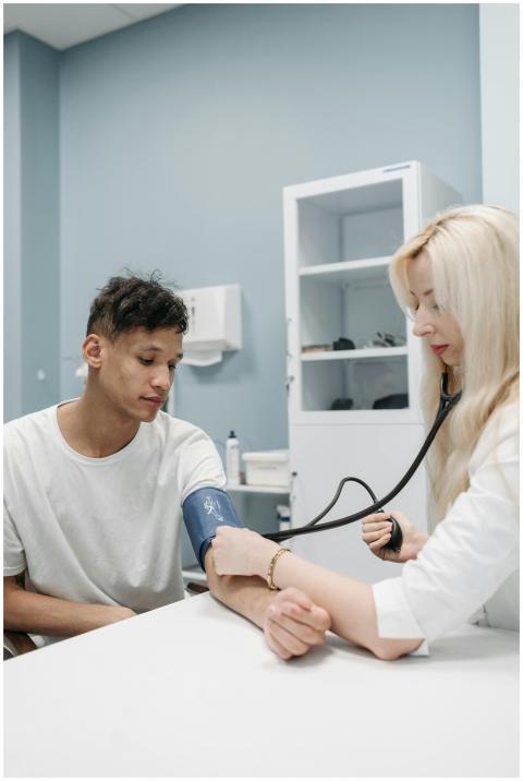 A professional doctor checking a patient's blood p