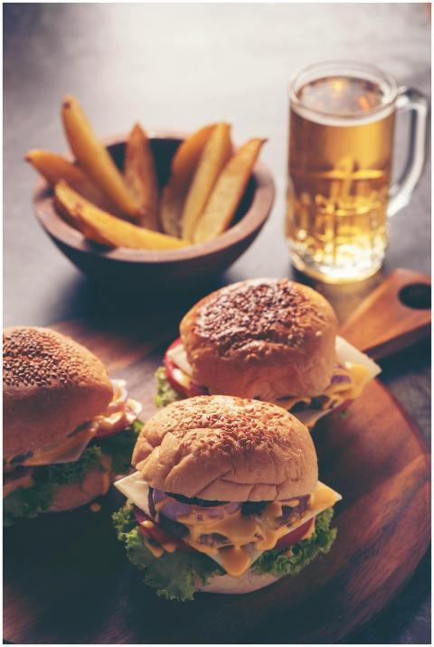 Close-up of delicious cheeseburgers with fries and