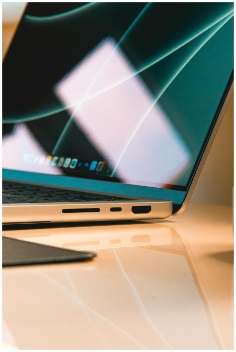 Vertical shot of a modern, illuminated laptop scre