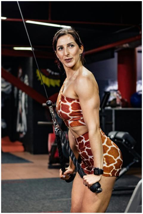 Woman working out at the gym in giraffe print acti