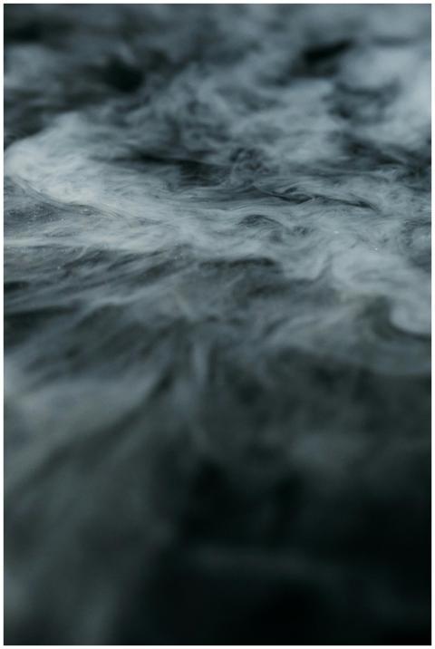 Mysterious swirling smoke forming abstract pattern