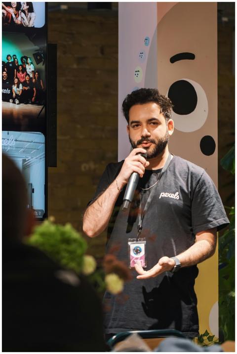 Man delivering a speech with a microphone at an in