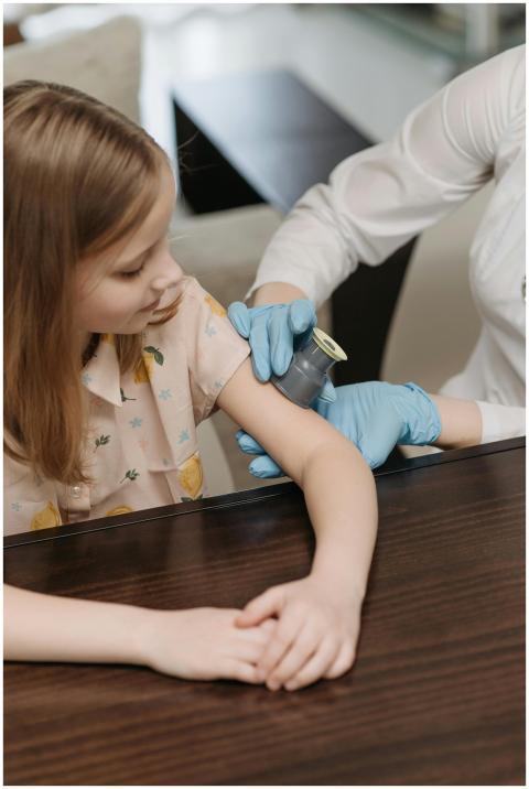 Child undergoing a blood sugar level test during a