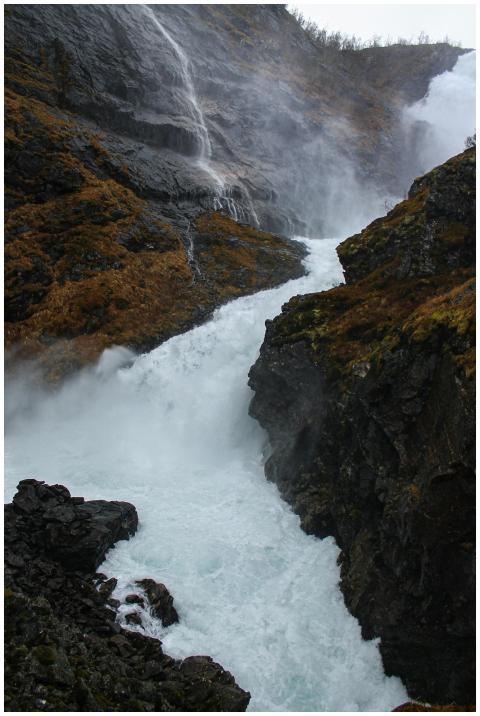 Breathtaking view of a cascading waterfall in Flåm
