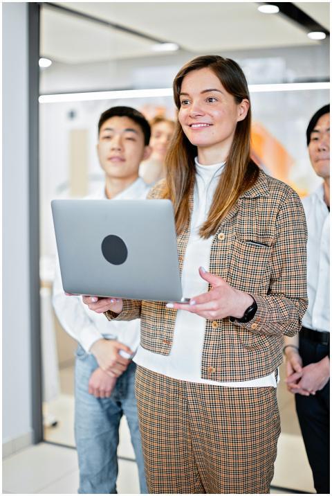 Group of young adults working together in an offic