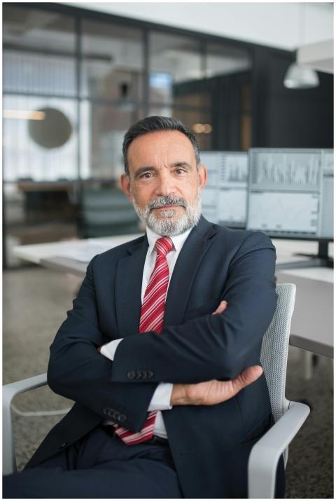 Professional businessman sitting confidently in a