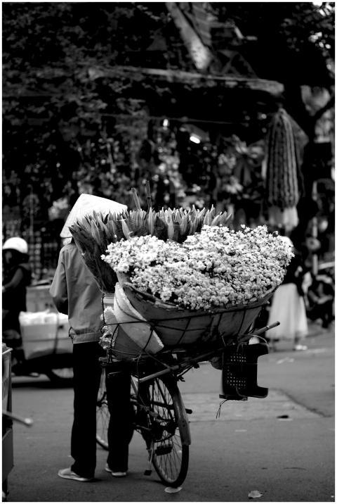 Black and white photo of a street vendor with flow
