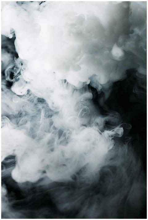 An ethereal composition of wispy smoke clouds agai