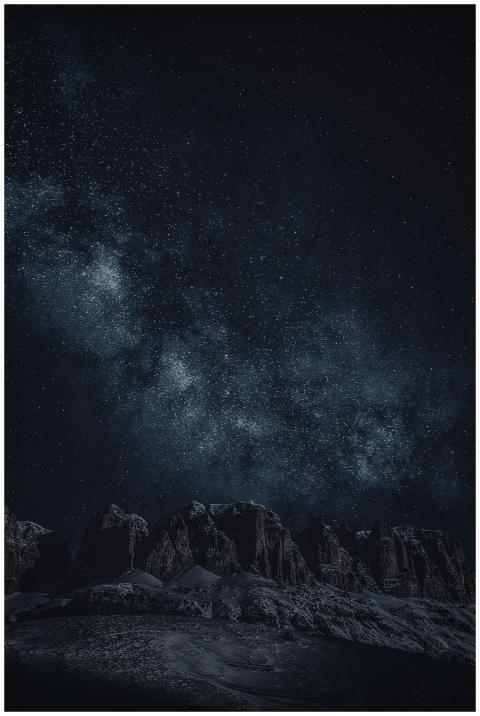 Stunning view of the starry night sky with rocky m