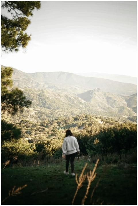 A person enjoys a peaceful walk with a scenic moun