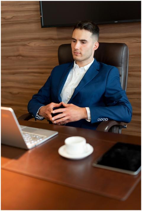 Professional businessman in a blue suit working at