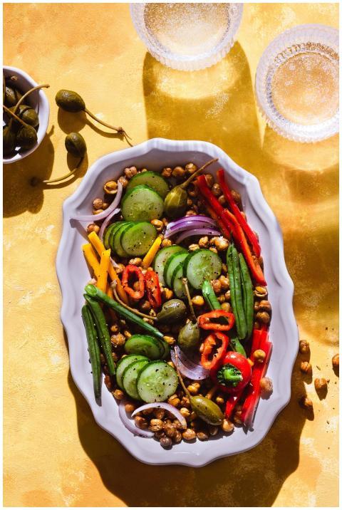 Colorful vegan salad with fresh vegetables and chi