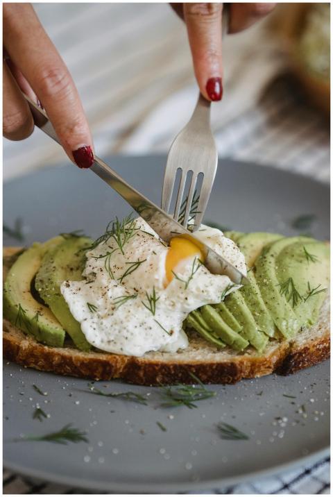 Delicious avocado toast topped with a perfectly po
