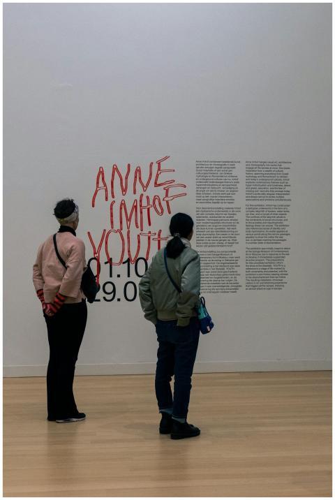 Two people engage with modern art in a museum sett